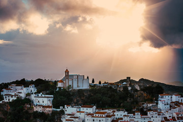 Fototapeta na wymiar White Andalusian village - pueblo blanco - in the mountain range in Casares during sunset