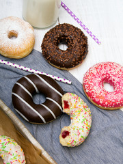 Colorful donuts with chocolate and icing, selective focus