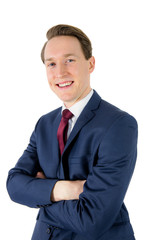 Happy businessman looking at camera with arms crossed 