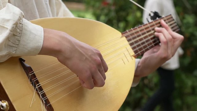 italian musician playing mandolin-close up