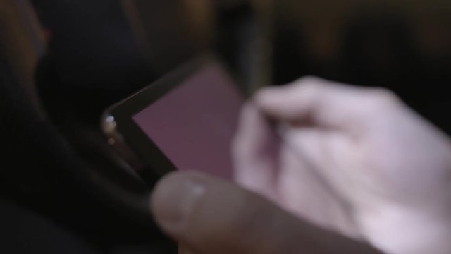 close-up person hold digital tablet blank screen, selective focus. Stock. Male hands holding a white tablet with copy space close up. tablet in hands