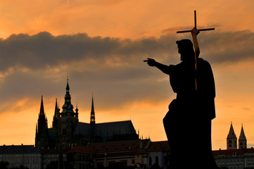 Prague Castle and Statue on the Charles Bridge in Prague, Czech Republic.