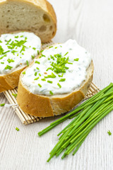 Bread with cheese spread and chives. healthy breakfast concept. 