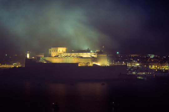 Malta International Fireworks Festival 2017, colourful fireworks over the Grand Harbour, in front of Fort St Angelo, Valletta, Malta, April 2017
