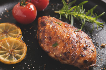 roasted chicken fillet breast with lemon tomato rosemary 