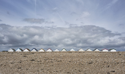Beach huts viewed from the sea on Goring Beach, Sussex