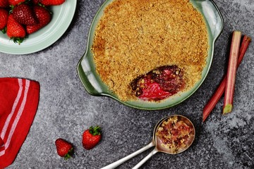 Rhubarb crumble with strawberries isolated