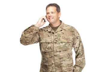U.S. Army Soldier, Sergeant. Isolated with cell phone.