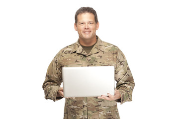 U.S. Army Soldier, Sergeant. Isolated with laptop.
