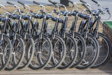 lots of black bikes in the Parking lot