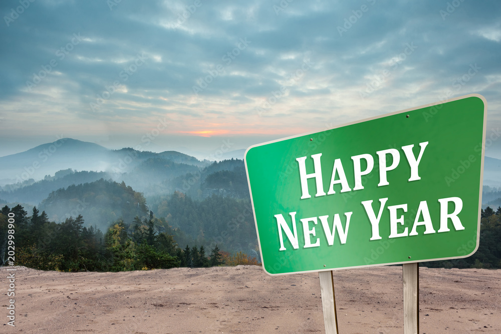 Wall mural Happy new year against misty landscape