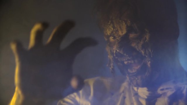 scary zombie closeup on dark background