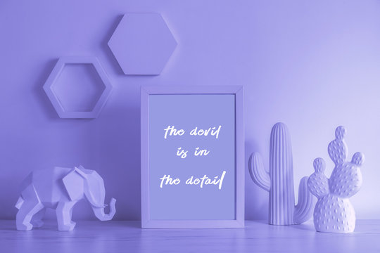 The modern purple desk with cacti, elephant figure and photo frame. Design mock up phrame and lightbox concept.