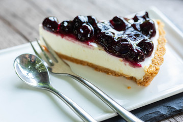 blueberry cheese cake on wooden table