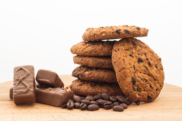 Oatmeal cookies on a wooden board, white background
