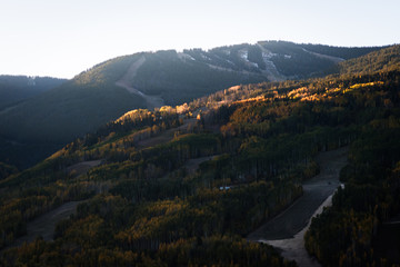 Vail Colorado lit up during sunrise in autumn. 