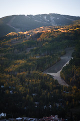 Vail Colorado lit up during sunrise in autumn. 