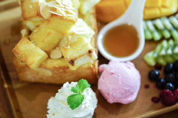 Honey toast and ice cream with Mixed Fruit and caramel.