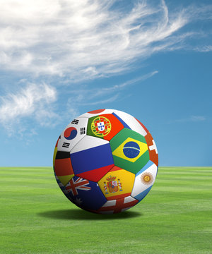 Soccer ball with flags in a green field
