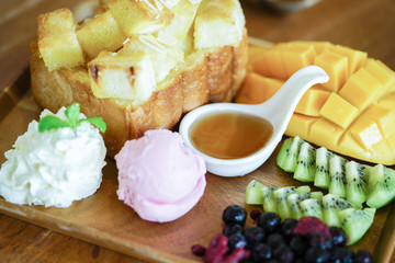 Honey toast and ice cream with Mixed Fruit and caramel.