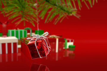 Composite image of Red christmas decoration hanging from branch against red vignette