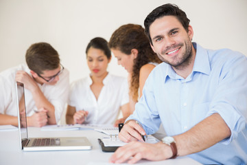 Happy businessman in meeting room