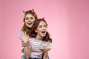 two little girls with a lollipop