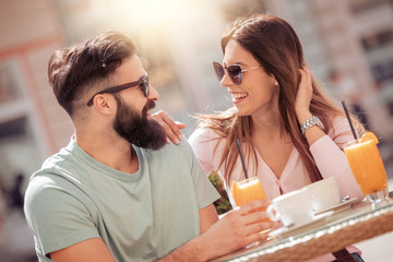 Happy couple enjoying a coffee at the coffee shop