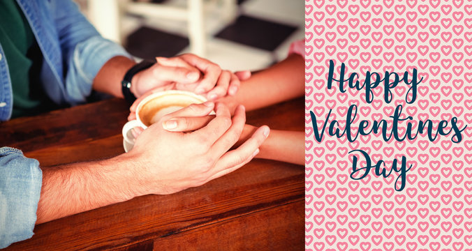 valentines words against cropped image of couple holding hands
