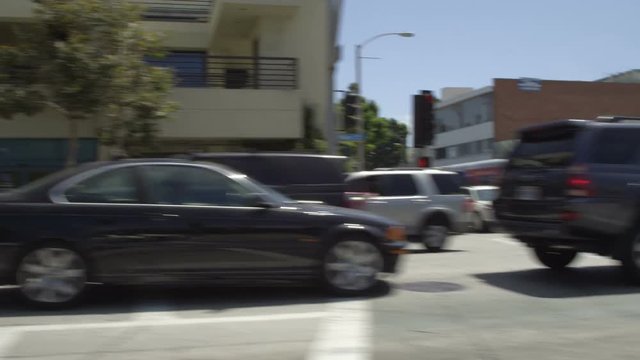 Left Side view of a Driving Plate: Car traveling on Pico Boulevard in Santa Monica, California, turns right onto Main Street and continues, turns right onto Olympic Drive, and continues to the intersection with 4th Street.