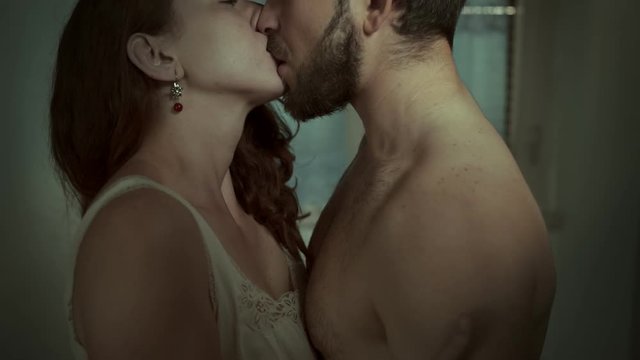 close up on lovers kissing passionately before sex