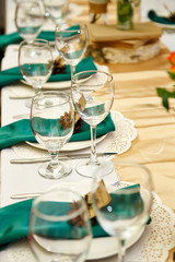 Festive table setting in the restaurant with flowers. Wedding decor.