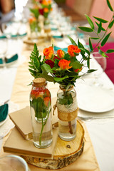 Obraz na płótnie Canvas Wedding Table Decoration. Beautiful flowers on the table