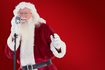 Santa Claus is singing Christmas songs against red background