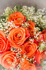 roses bouquet for a wedding on stone stairs with blurry  background