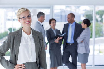 smiling businesswoman looking at the camera  