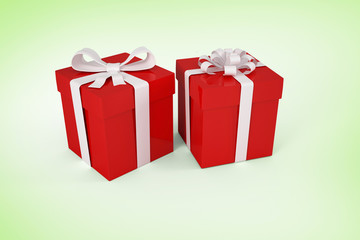 Red gifts with white bow against green vignette