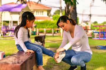 Mom is taking care of the injured daughter.