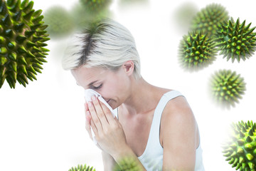 Sick woman blowing her nose against virus