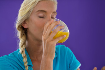 Beautiful woman drinking smoothie