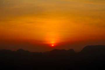 sunset with mountain view with cross road silhouette front view