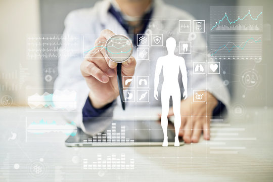 Doctor using modern computer with Medical record diagram on virtual screen concept. Health monitoring application.