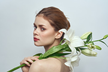 woman with flowering lily beauty