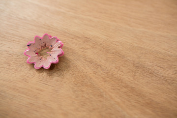 Fototapeta na wymiar Pink color pencil shaving in a flower shape