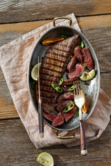 Top view grilled beef meat frying pan wooden table