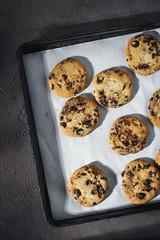 Close up homemade chocolate cookies baking tray top view
