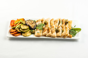 body of squid fried with lemon on white plate on white background