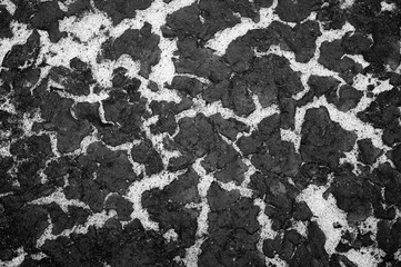 The texture of the bottom of the reservoir sand and the accumulation of silt on top. Background. Black and white image