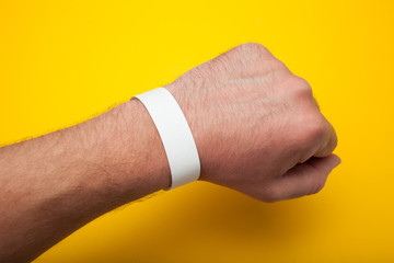 Empty concert bracelet on hand, mockup. © Andrii Zastrozhnov