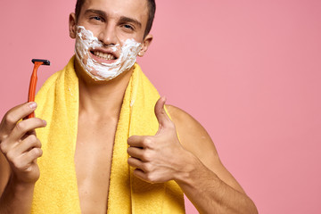 handsome man gesticulating with hands and shaving foam on his beard